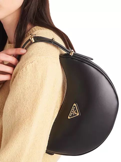 prada arque leather shoulder half moon bag 