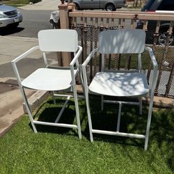 white, Metal/aluminum bar stools (high chairs) with arms and a footrest