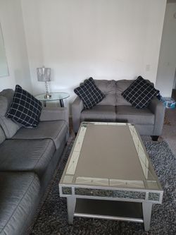 Gray Couch With Coffee Table And Rag