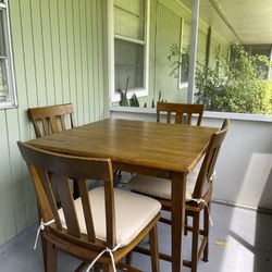 Wood Table with 4 Chairs and cushions 