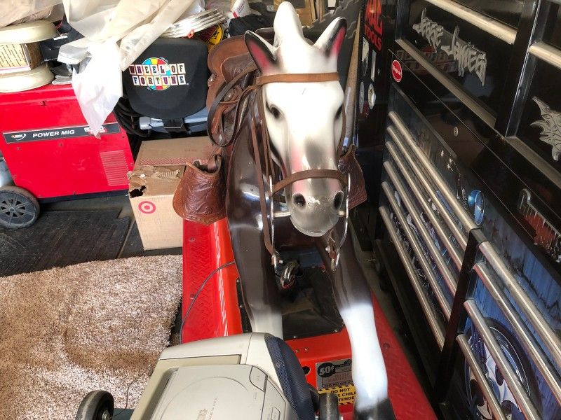 Kiddie ride . Quiksilver coin operated horse