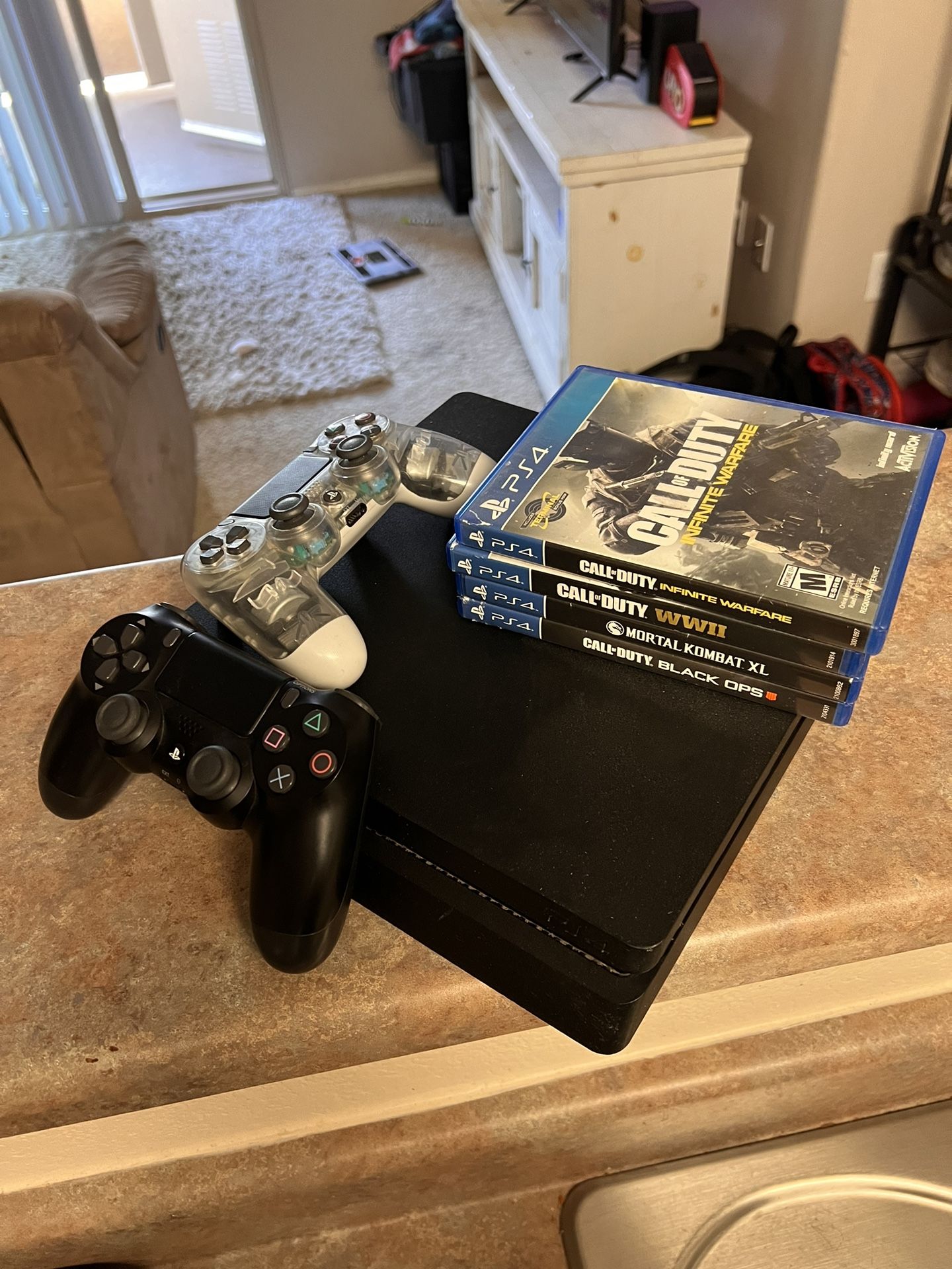 Used PS4 W/ 2 Controllers And Assorted Games