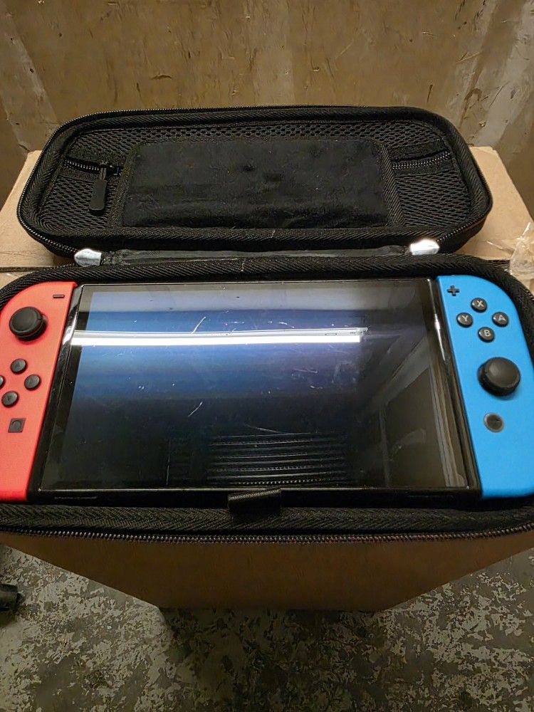 Nintendo Switch OLED with Case, Charger, 3 Games, And 64gb Storage Card