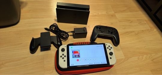 Nintendo switch OLED with no more heroes three, docking station, charger and case. No trades cash only see my other listings for more gaming stuff.