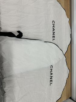 x2 white Chanel garment bag with black piping 