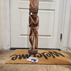 a vintage hand-carved wooden statue 