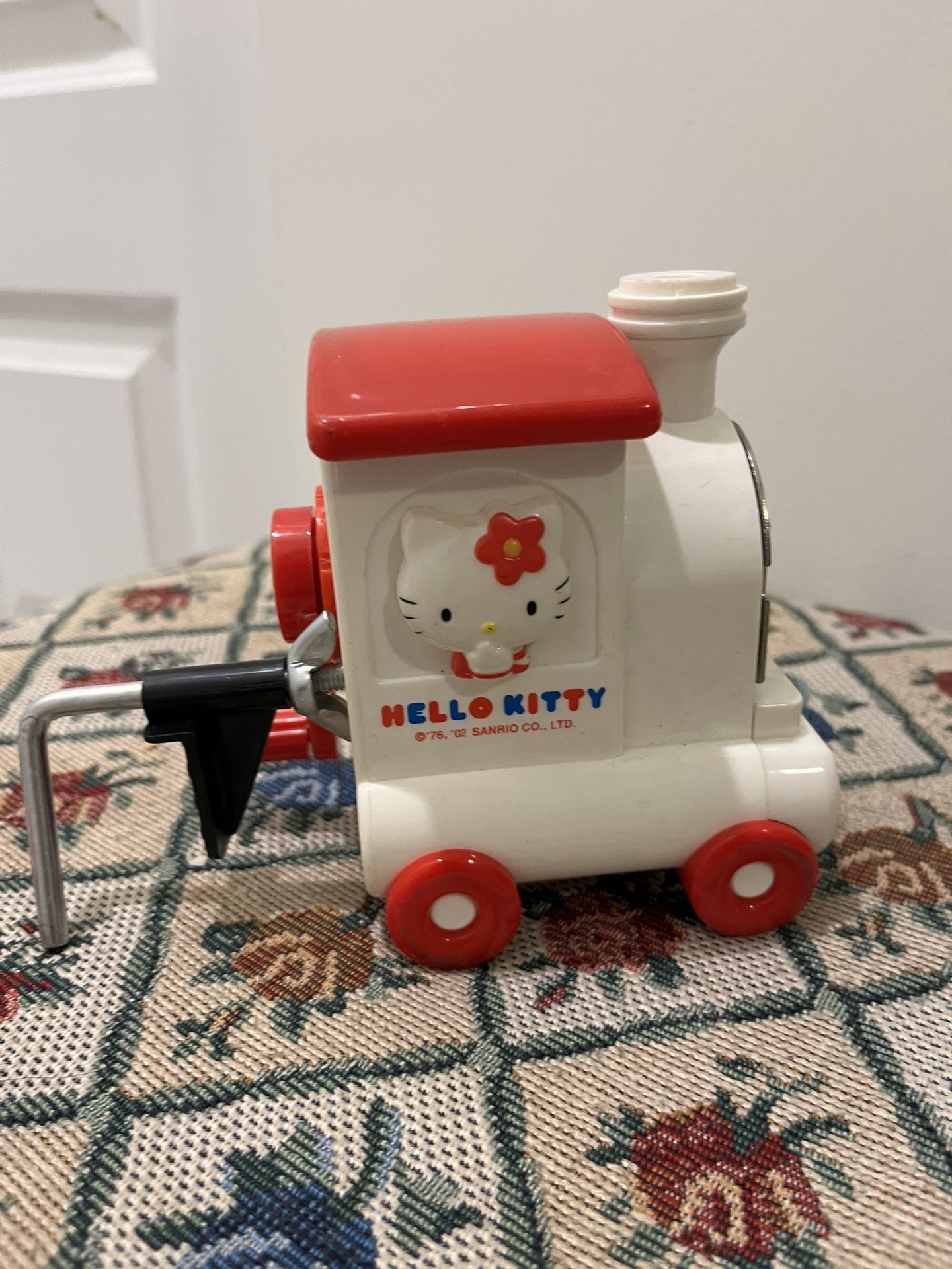 Three For One Hello Kitty Train Pencil Sharpener(new), Barbie Dream house Bracelet, And Barbie Light Up Phone