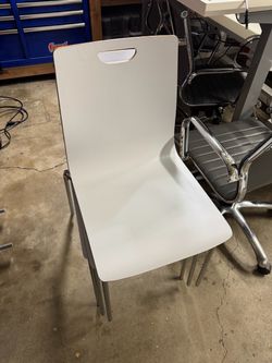 White molded stacking chair