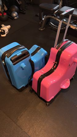 FREE kids roller suitcases.