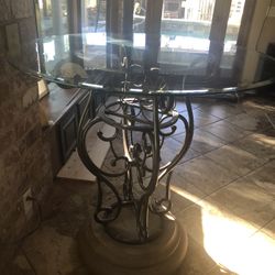 42’ table with wine holder. Beveled glass top 42’