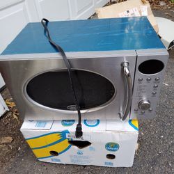 Brand New Oster Counter Top Microwave  NEVER Used