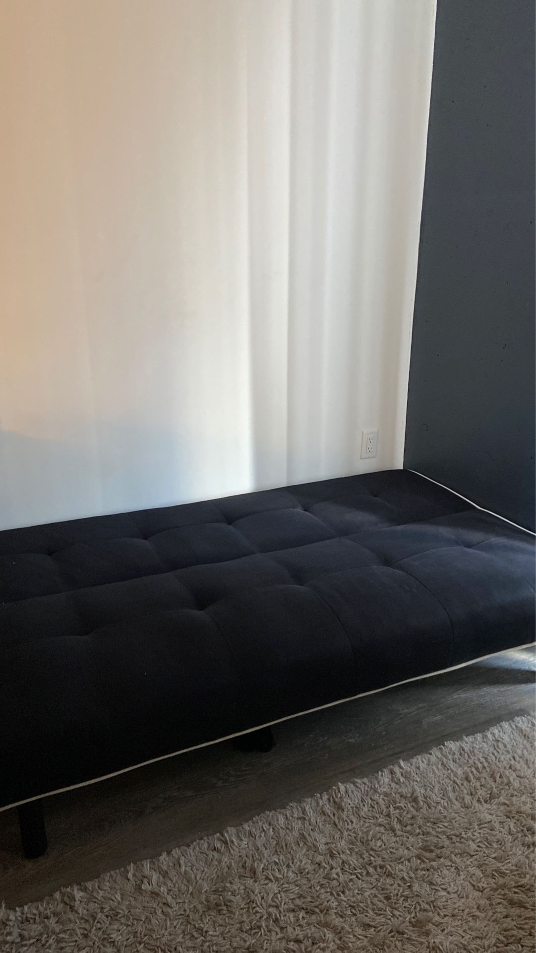 Black futon with white rim