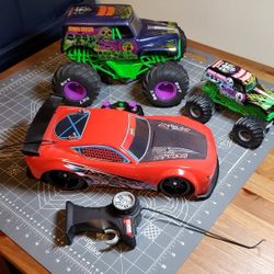 Grave Digger RC Truck, smaller Grave Digger Truck, and Camaro Like RC Car And Remote