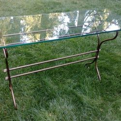 Console table with bronze base, 1/2" glass top with rounded edge in perfect condition