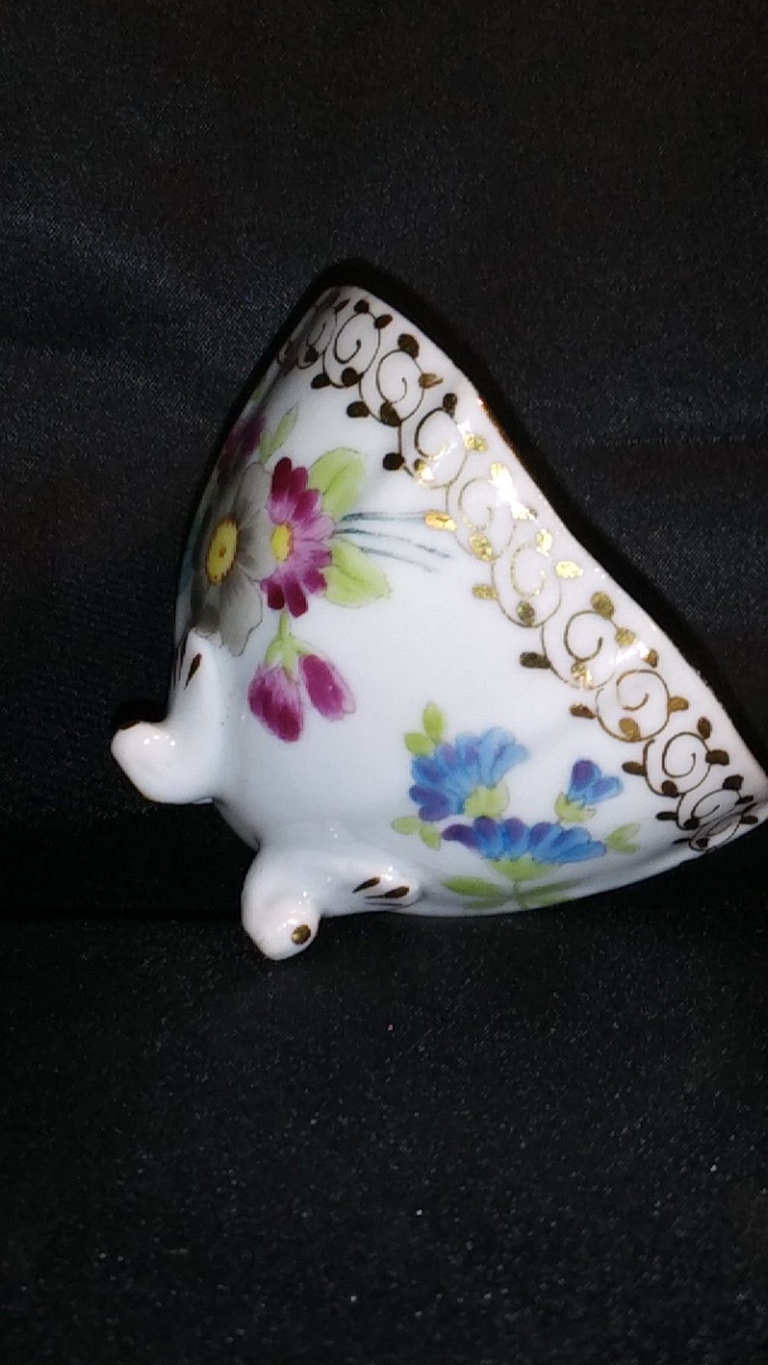 Miniature Porcelain Tea Cup. Four Footed Hand Painted Gold Trim
