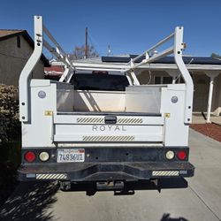 Chevy utility truck, wood lumber rack diamond plate in the back.Registered up the date brand new tires inside like new