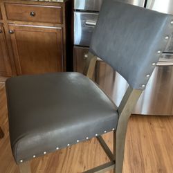 2 Matching Gray Leather Counter Hight Chairs 
