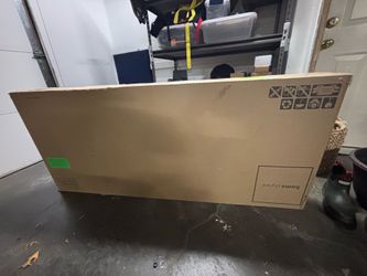 Wooden office desk still in the box