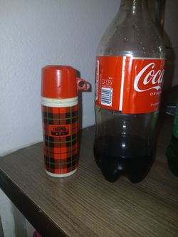 Vintage 1970s Avon sweet honesty cologne decanter shaped like a mini red and black plaid thermos