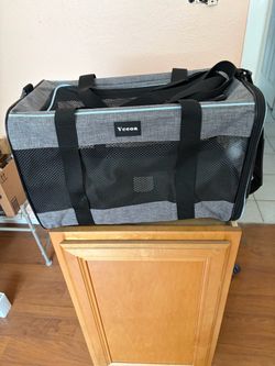 Small carrier for dog or cat.