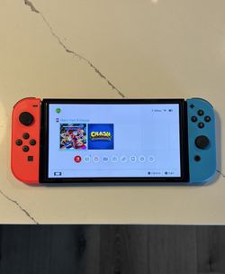 Nintendo Switch Bundle w/ Mario Kart 8 Deluxe + Extra Game + Case