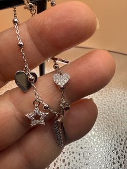 Sterling silver Seven 7 charm bracelet 7 1/2 inches adjustable with a high-quality stone