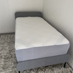 Twin Bed + DreamCloud Mattress – $100 Upholstered twin bed with luxury