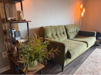 Green couch from American furniture warehouse