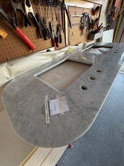 2 white porcelain sinks and marble top