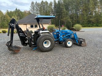 New Holland four by four 1920 Tractor with Loader and Backhoe