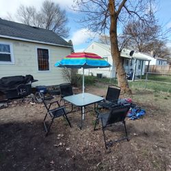 Outdoor Table And Chairs And Umbrella