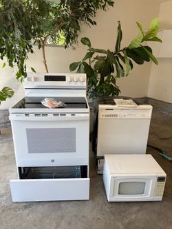 GE Electric Range with Whirlpool Dishwasher and Microwave
