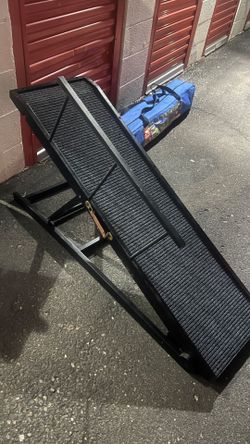 Large wooden dog ramp with side arms and carpet to prevent slipping and falling