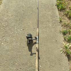 Old spinning rod with a wooden handle plus a reel with fishing line