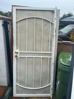 Door Durable metal security screen door is white with a perforated mesh backing.  Cash only Height 80 inches  Width 36 inches  Pick up in sun valley  