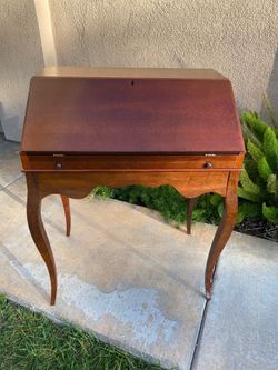 Selling a small desk in good solid condition “ Bombay” furniture