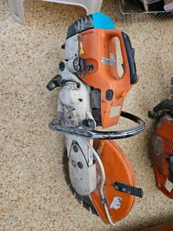 STIHL TS400 64cc gas-powered concrete cut-off saw with an orange and white housing and a 14-inch abrasive wheel