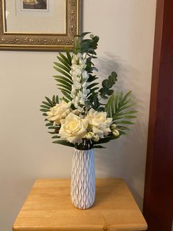 Floral arrangement in White Ceramic Vase with Wave Pattern