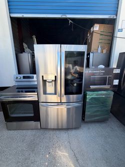 Full kitchen in LG stainless steel with 2 months warranty, delivery and installation available  Fridge 35 wide full depth used  Stove 30 wide  used  M
