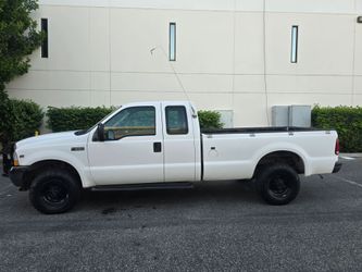 2002 Ford F-250 5.4 v8 4x4 ext cab 8ft bed 171k milles just smog cold ac clean title one owner reg current located in pomona 9o9236I97o runs good no p