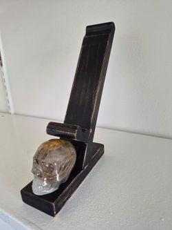 Base para teléfono con cráneo de calavera