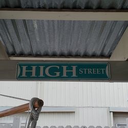 Metal high st. sign