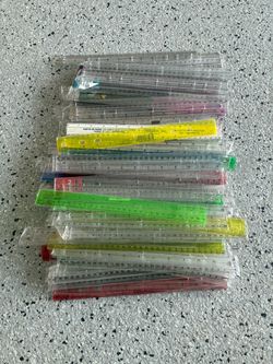 Variety Lot of 130 12” Plastic Rulers. Mostly New and Sealed. Pre Owned.