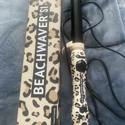 (2) Beachwaver Curling irons S1 (new) And 1.25 Barrel (used)