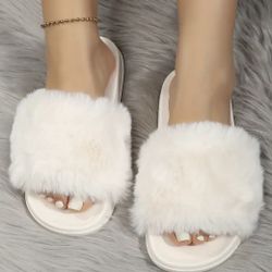 Pantuflas blancas número “9”