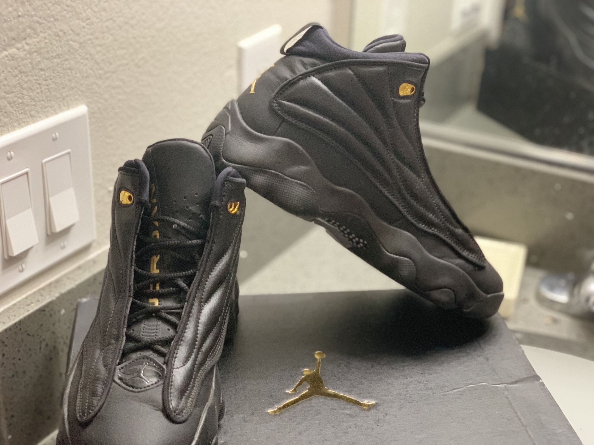 Limited editions black and gold jordan 13’s