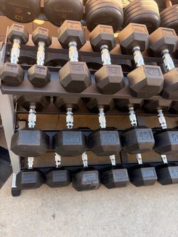 Selling rubber hex coated dumbbells in like new condition. 1 dollar per pound  rack is 200