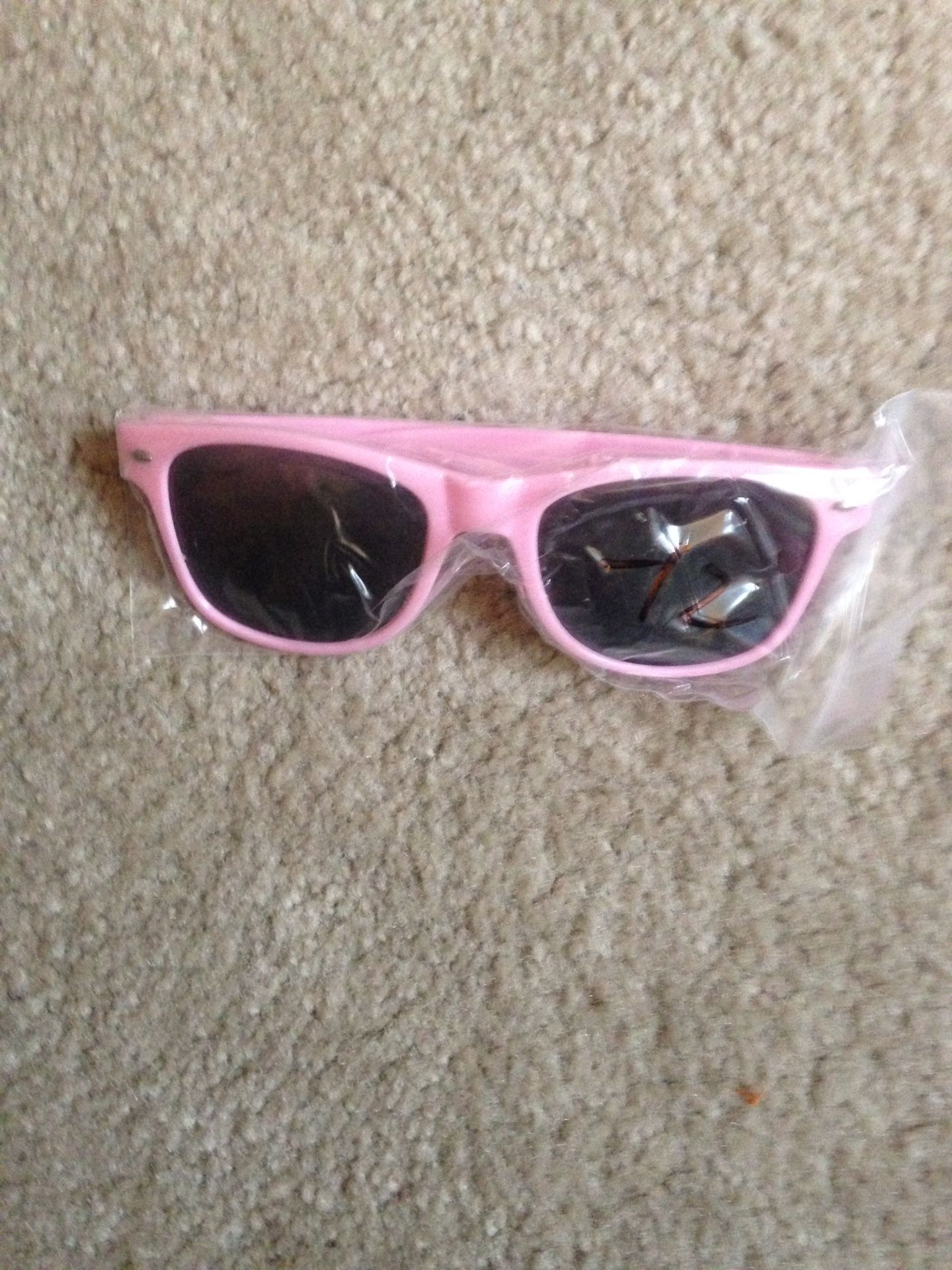 Novelty sunglasses. Plastic pink rimmed black lenses. New!!