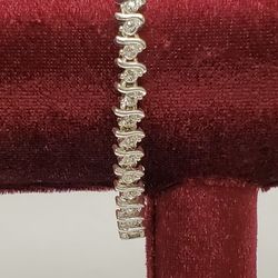 Silvertone Tennis Bracelet With Clear Rhinestones And Fold Over Clasp