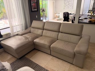 Leather sectional sofa with chaise and adjustable headrest